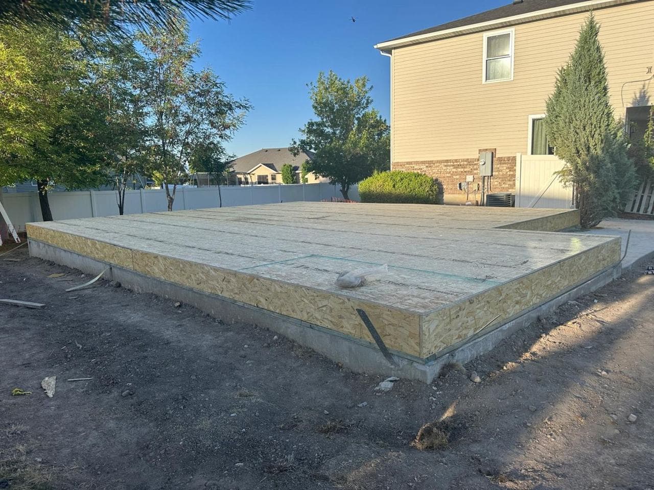 Completed subfloor platform on the foundation beside the existing home