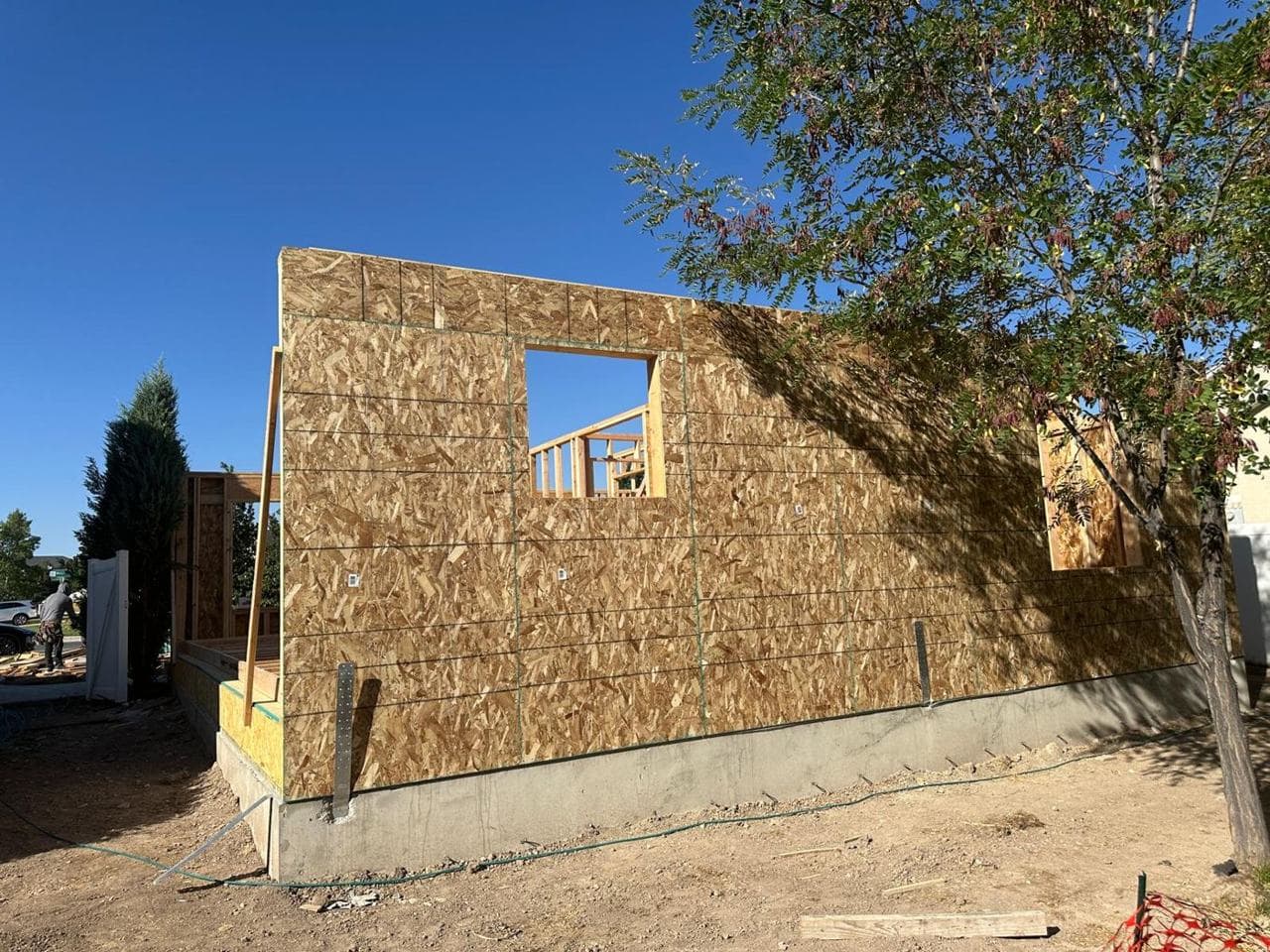 Exterior wall sheathed in OSB with a framed window opening