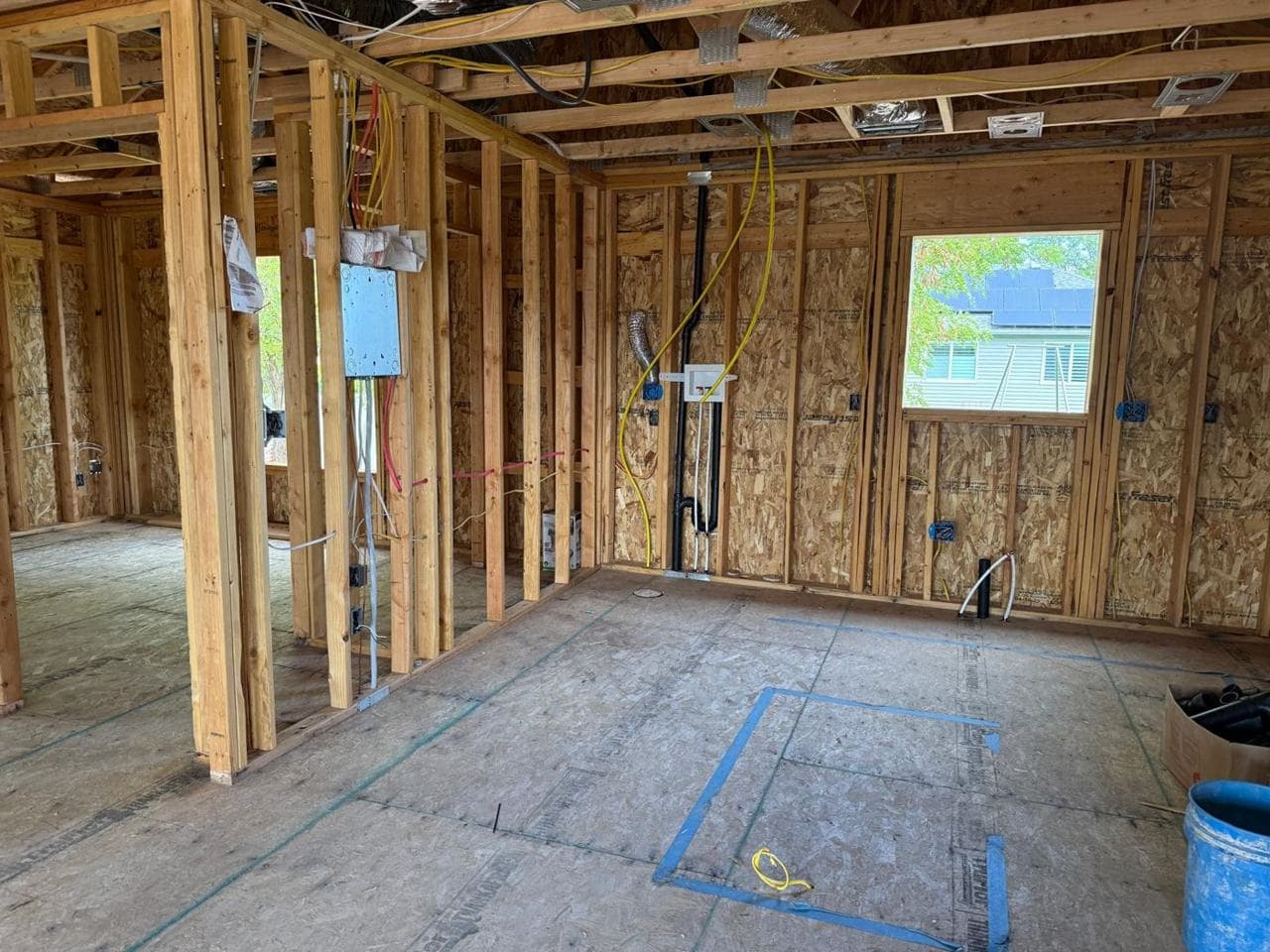 Room framing with electrical boxes, wiring and a window