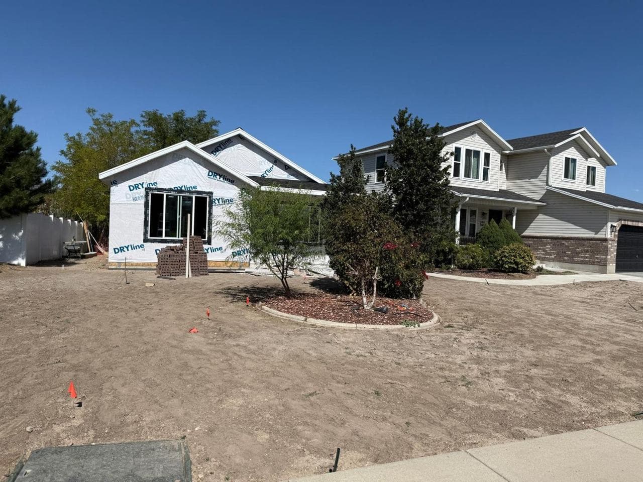 Windows installed and house wrap applied across the front of the addition