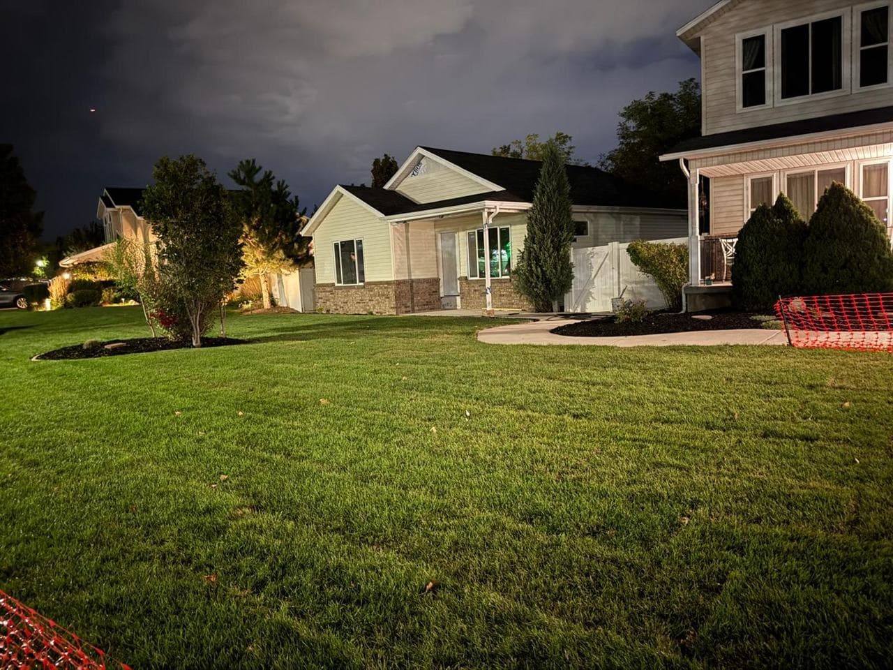 Restored lawn beside the new addition in the evening