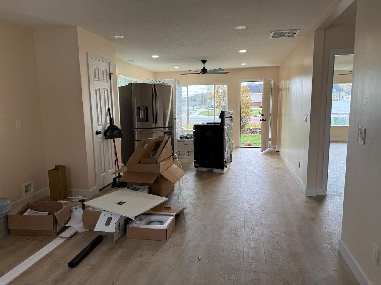 Open floor plan from the kitchen toward the living area and back door